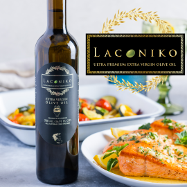 A square banner with a bottle of Laconiko extra virgin olive oil near white plates of salmon and vegetables, and the Laconiko logo 